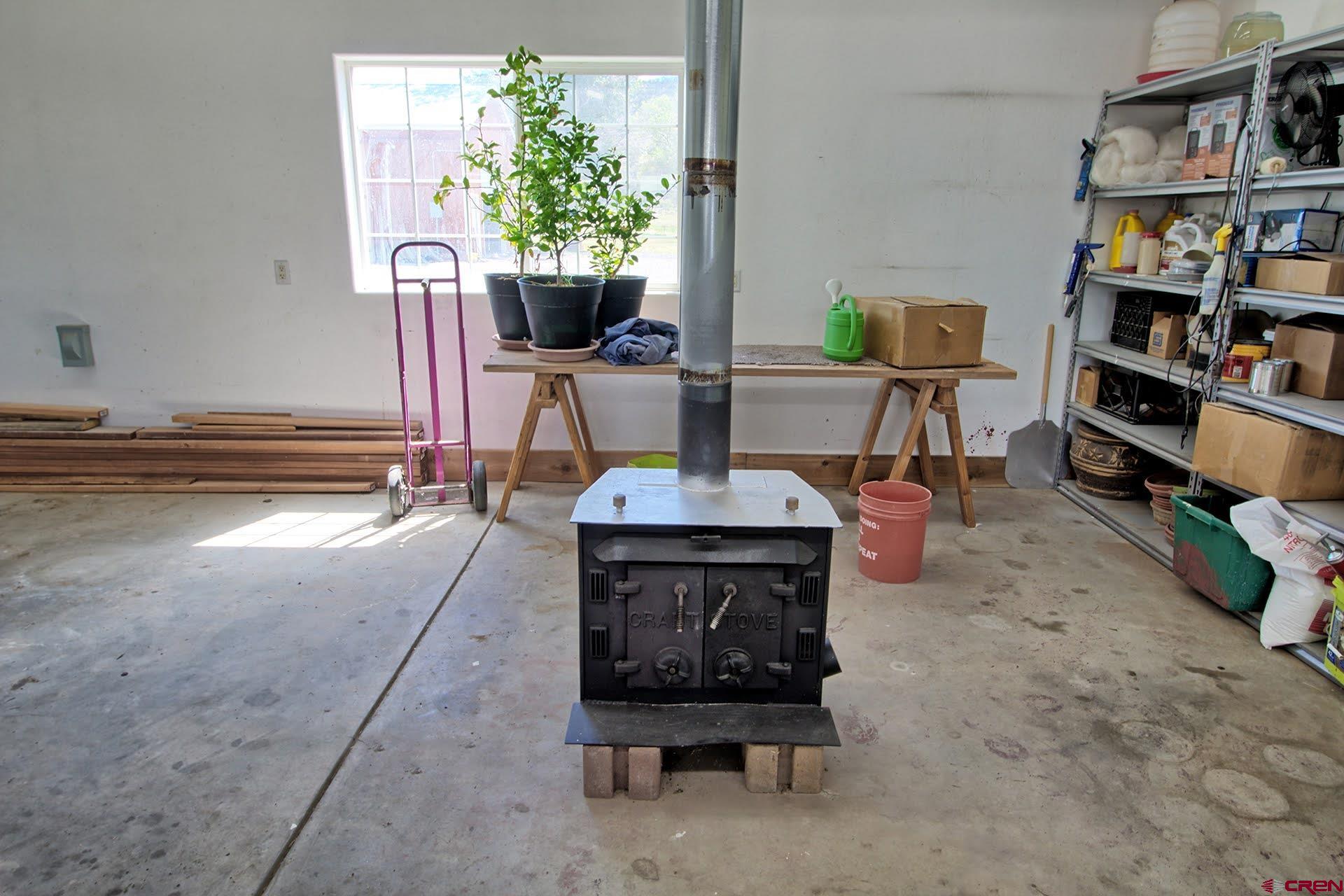 1036 East Main Street Cedaredge, CO 81413 - Photo 32 of 36 a living room with furniture and a book shelf