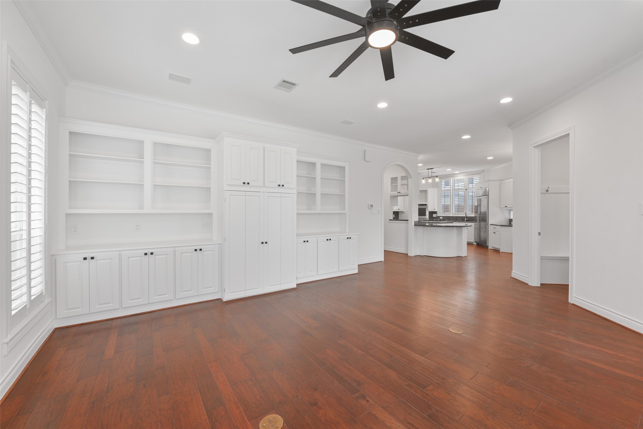 3724 Wroxton Road Houston, TX 77005 - Photo 11 of 40 The large living room also has ceiling fan, recessed lighting, and more built-ins! It is open to the kitchen. Great layout for entertaining!