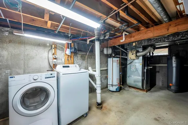 a view of storage and utility room with washer and dryer