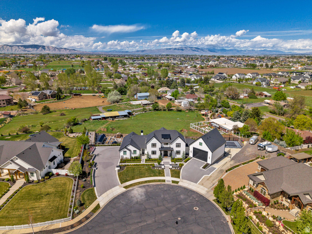 1720 Hillcrest Circle Mapleton, UT 84664 - Photo 23 of 116 Aerial perspective of suburban area with a mountain backdrop