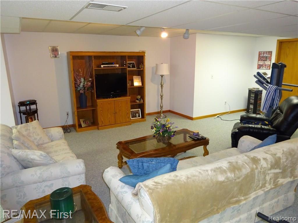896 Grovecrest Rochester, MI 48307 - Photo 35 of 57 FINISHED BASEMENT SEATING AREA