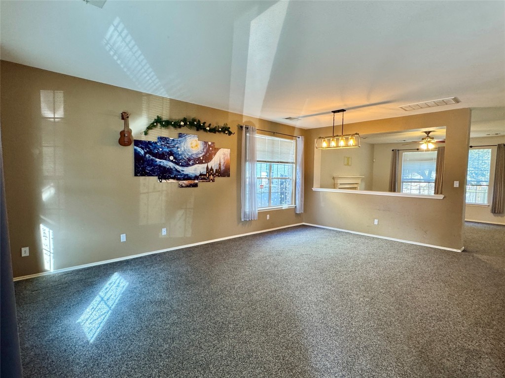 14605 Staked Plains Loop Austin, TX 78717 - Photo 2 of 30 Spare room with plenty of natural light and a ceiling fan