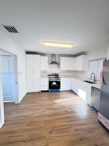 a view of livingroom with washer and dryer