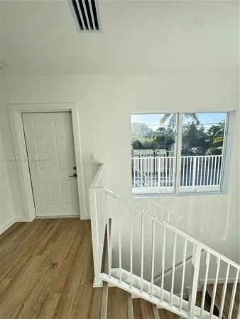 a view of a street with a view of a house