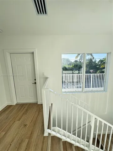 a view of a street with a view of a house