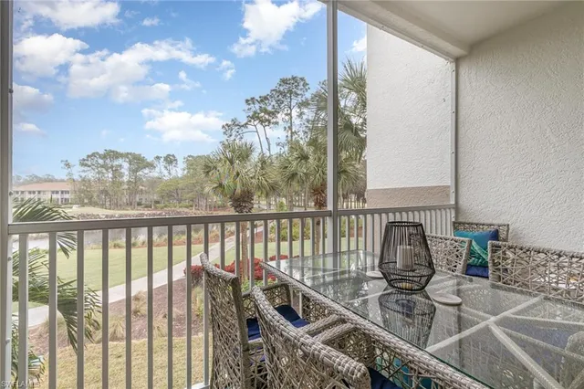 a view of a balcony with furniture