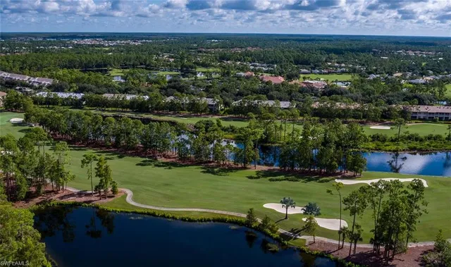 an aerial view of a house with a yard basket ball court and outdoor seating