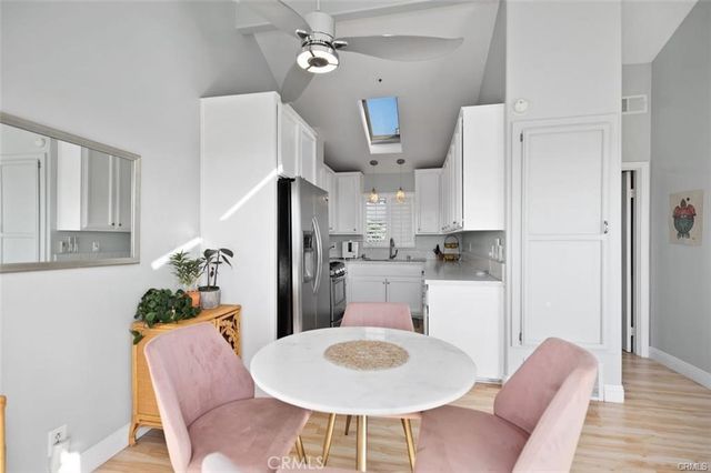 a kitchen with stainless steel appliances a refrigerator sink and microwave