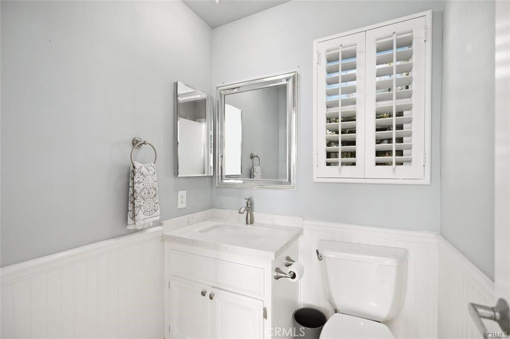 33772 Copper Lantern Street, Unit C Dana Point, CA 92629 - Photo 27 of 45 a bathroom with a sink a vanity and a mirror