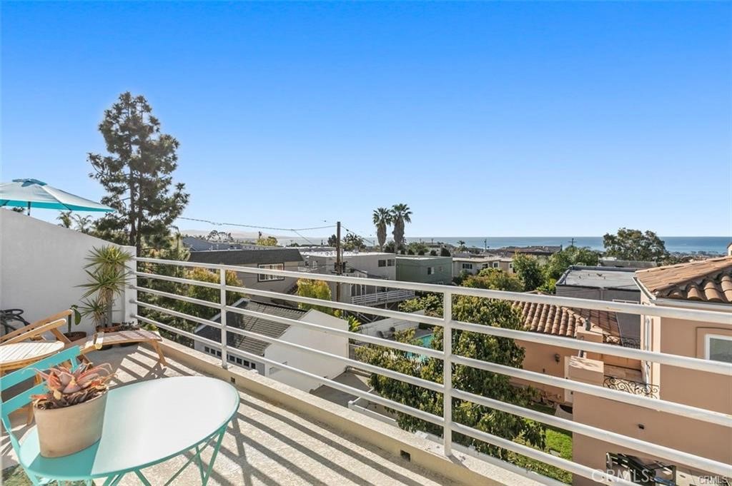 33772 Copper Lantern Street, Unit C Dana Point, CA 92629 - Photo 30 of 45 a view of a balcony with table and chairs