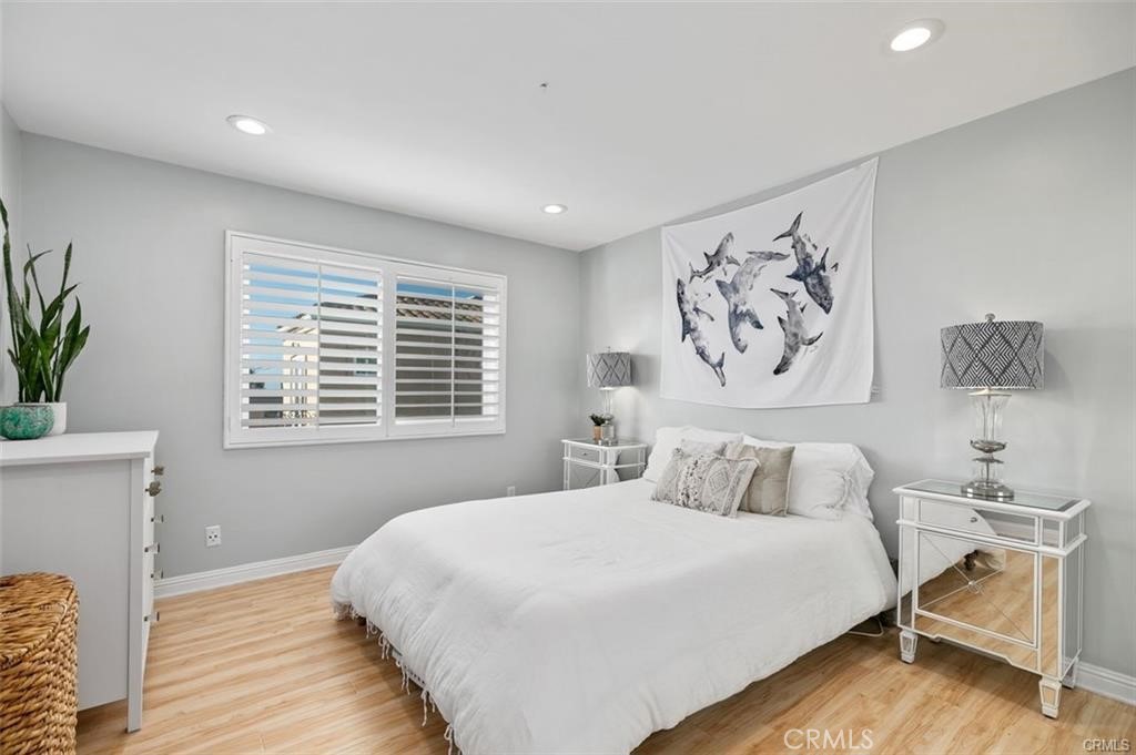 33772 Copper Lantern Street, Unit C Dana Point, CA 92629 - Photo 32 of 45 a bedroom with a bed and a window