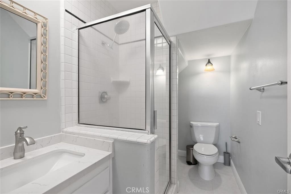 33772 Copper Lantern Street, Unit C Dana Point, CA 92629 - Photo 39 of 45 a bathroom with a sink a toilet and shower