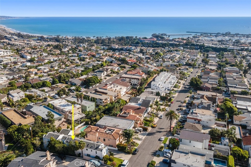 33772 Copper Lantern Street, Unit C Dana Point, CA 92629 - Photo 8 of 45 an aerial view of a city with lots of residential buildings and ocean view in back