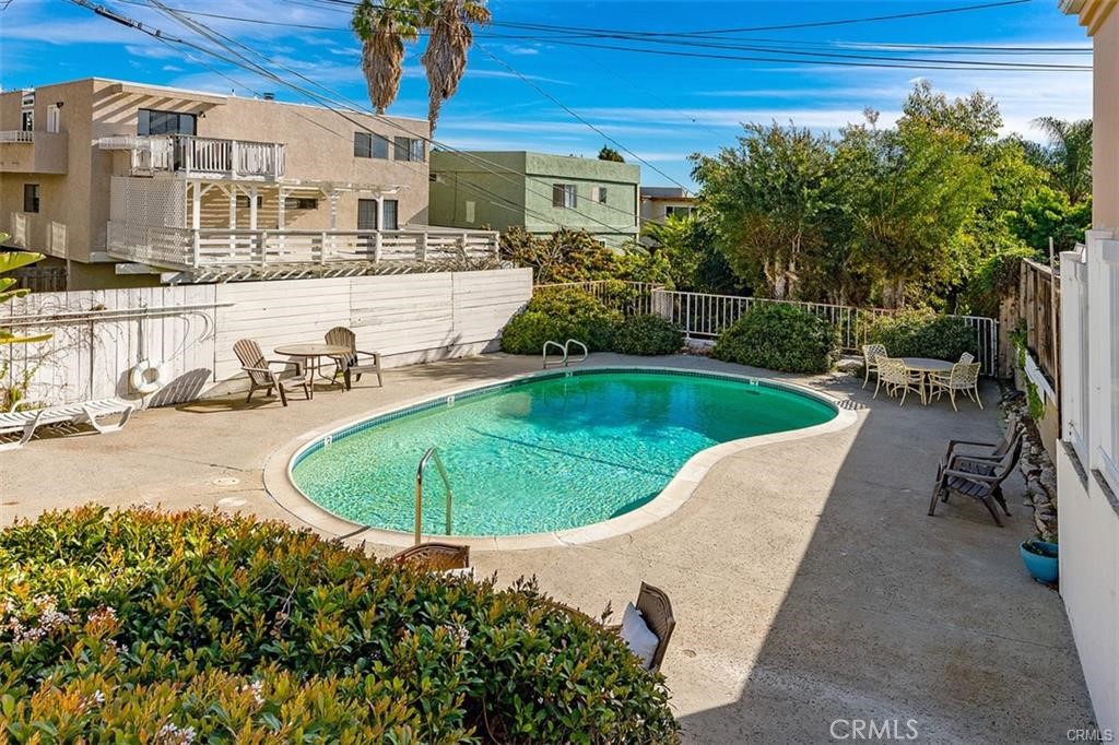 33772 Copper Lantern Street, Unit C Dana Point, CA 92629 - Photo 9 of 45 a view of a swimming pool with a patio