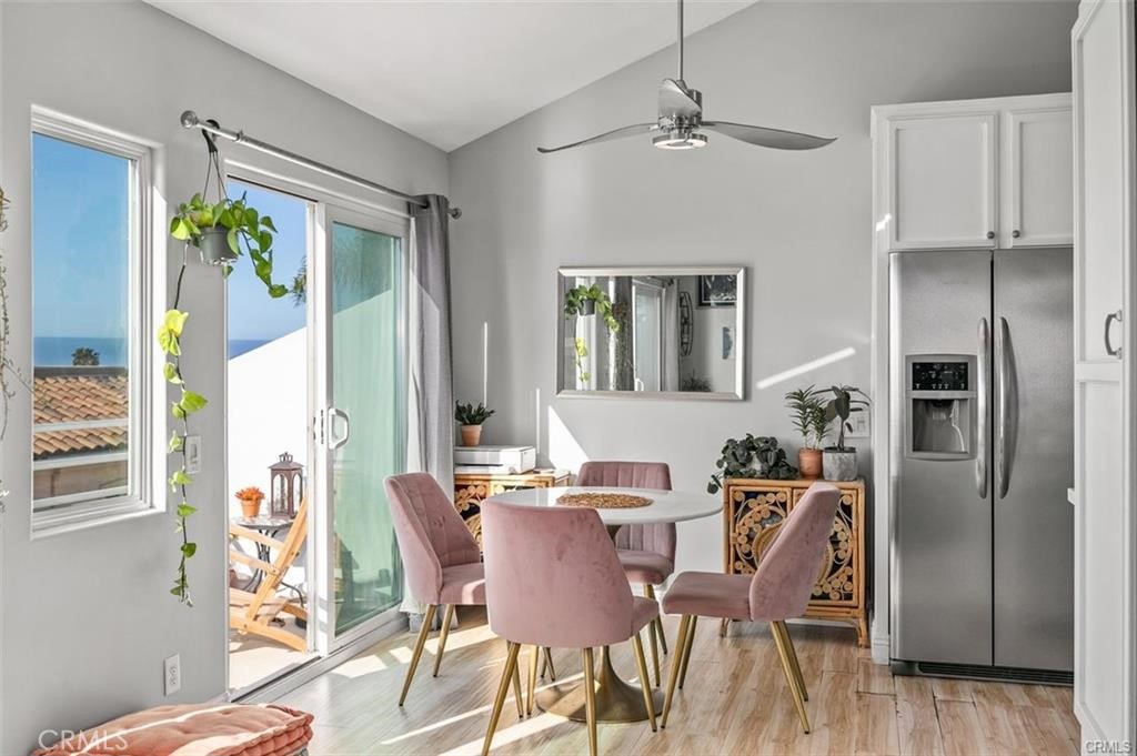 33772 Copper Lantern Street, Unit C Dana Point, CA 92629 - Photo 10 of 45 a view of a dining room with furniture window and wooden floor