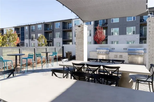 a living room with lots of furniture and clutter