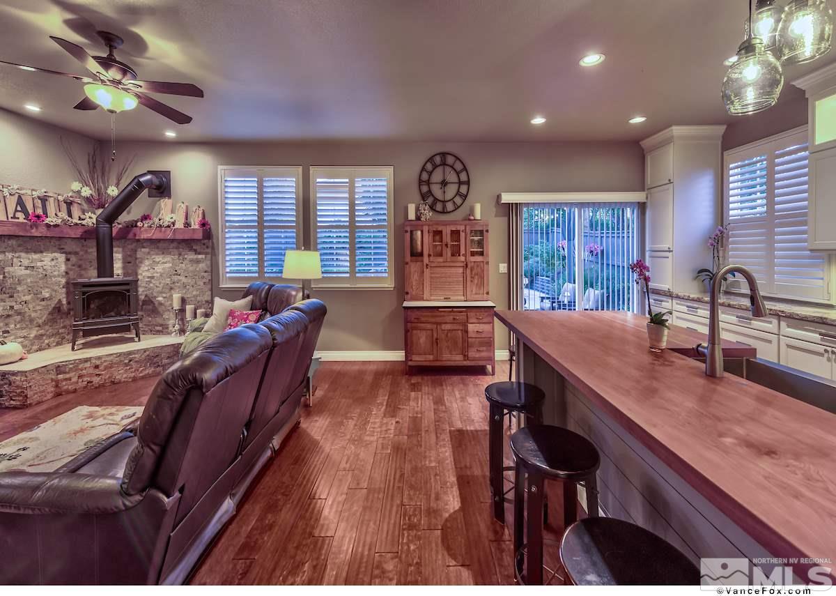 598 Needles Court Reno, NV 89521 - Photo 11 of 25 a living room with furniture and a wooden floor