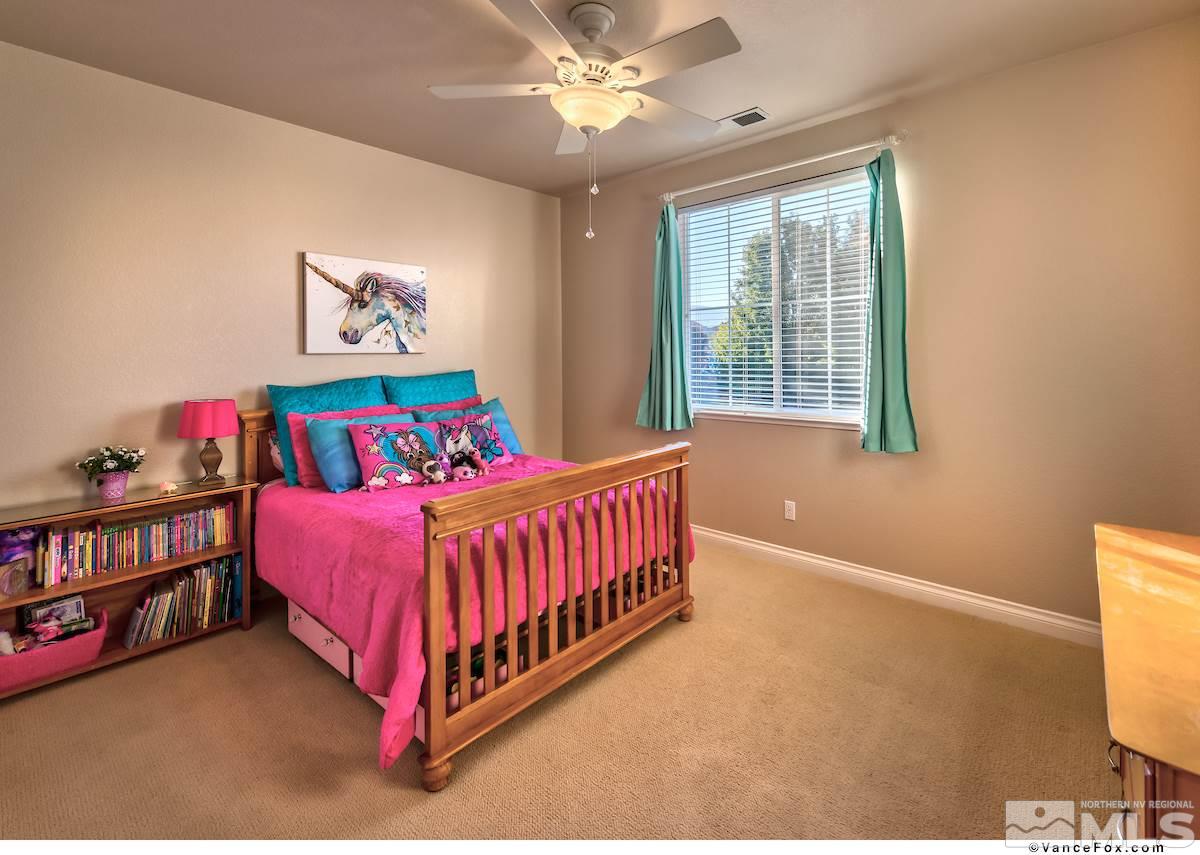 598 Needles Court Reno, NV 89521 - Photo 20 of 25 a bedroom with a bed and a window