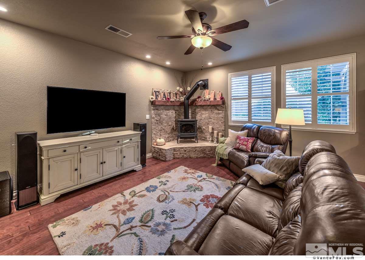 598 Needles Court Reno, NV 89521 - Photo 10 of 25 a living room with furniture and a flat screen tv