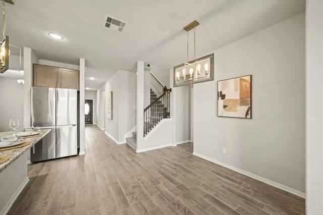 a kitchen with stainless steel appliances granite countertop a stove oven and a refrigerator