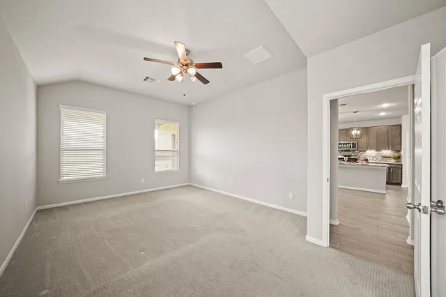 a bedroom with furniture and wooden floor