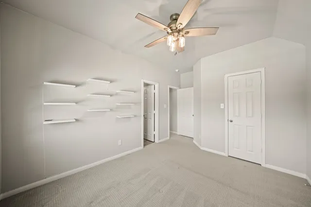 a bedroom with a bed and a potted plant