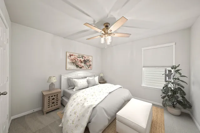 a bathroom with a sink a toilet a mirror and shower