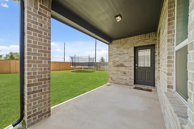 a view of a back yard of the house
