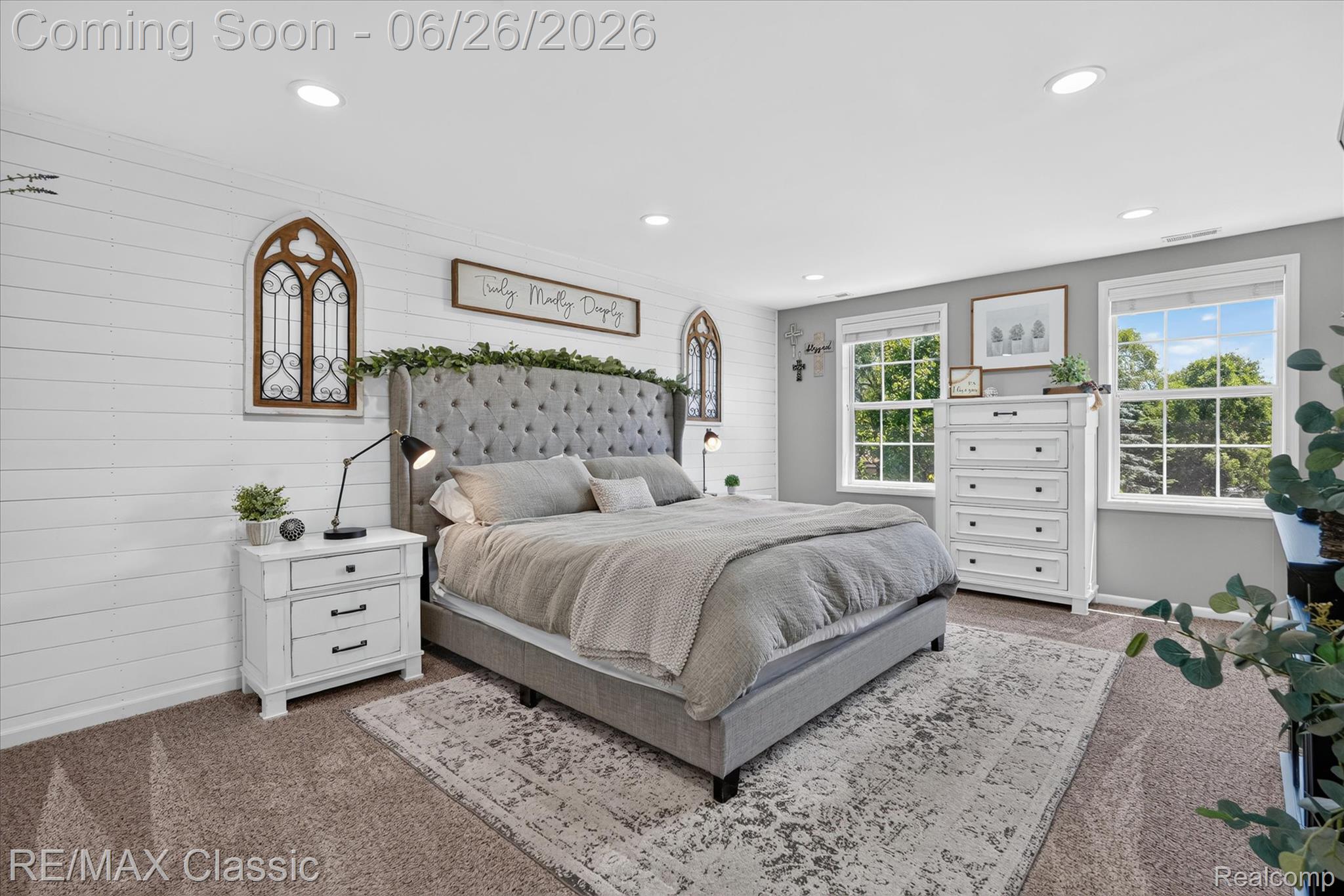 3205 North Milford Road Highland, MI 48357 - Photo 16 of 53 Bedroom featuring plush carpeting, recessed lighting, and a prominent shiplap accent wall