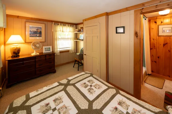 a bedroom with a bed and a closet