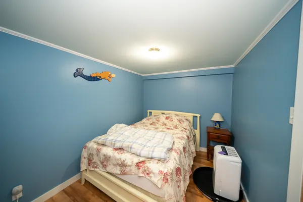 a bedroom with a bed and storage