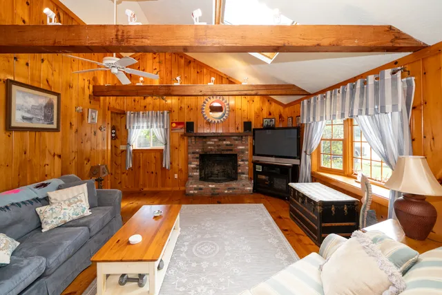 a bedroom with furniture and a fireplace