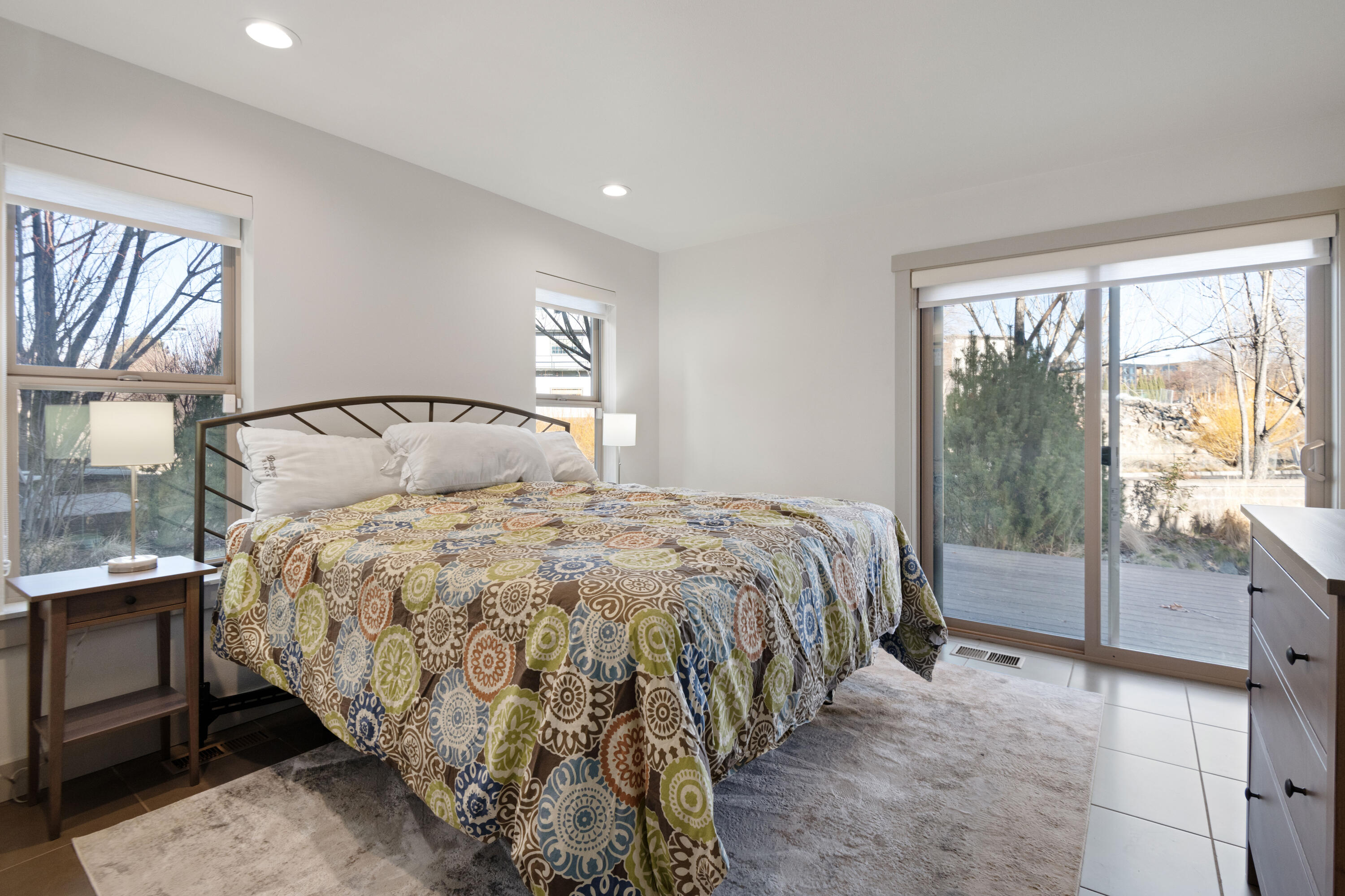 680 Southwest Otter Way Bend, OR 97702 - Photo 4 of 48 a large bed sitting in a bedroom next to a window