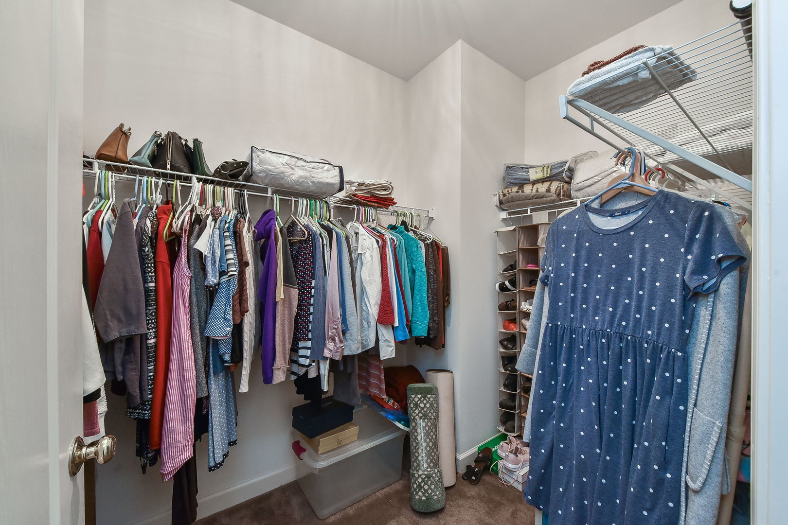 708 Bohannon Circle Oswego, IL 60543 - Photo 11 of 24 a view of walk in closet with clothes