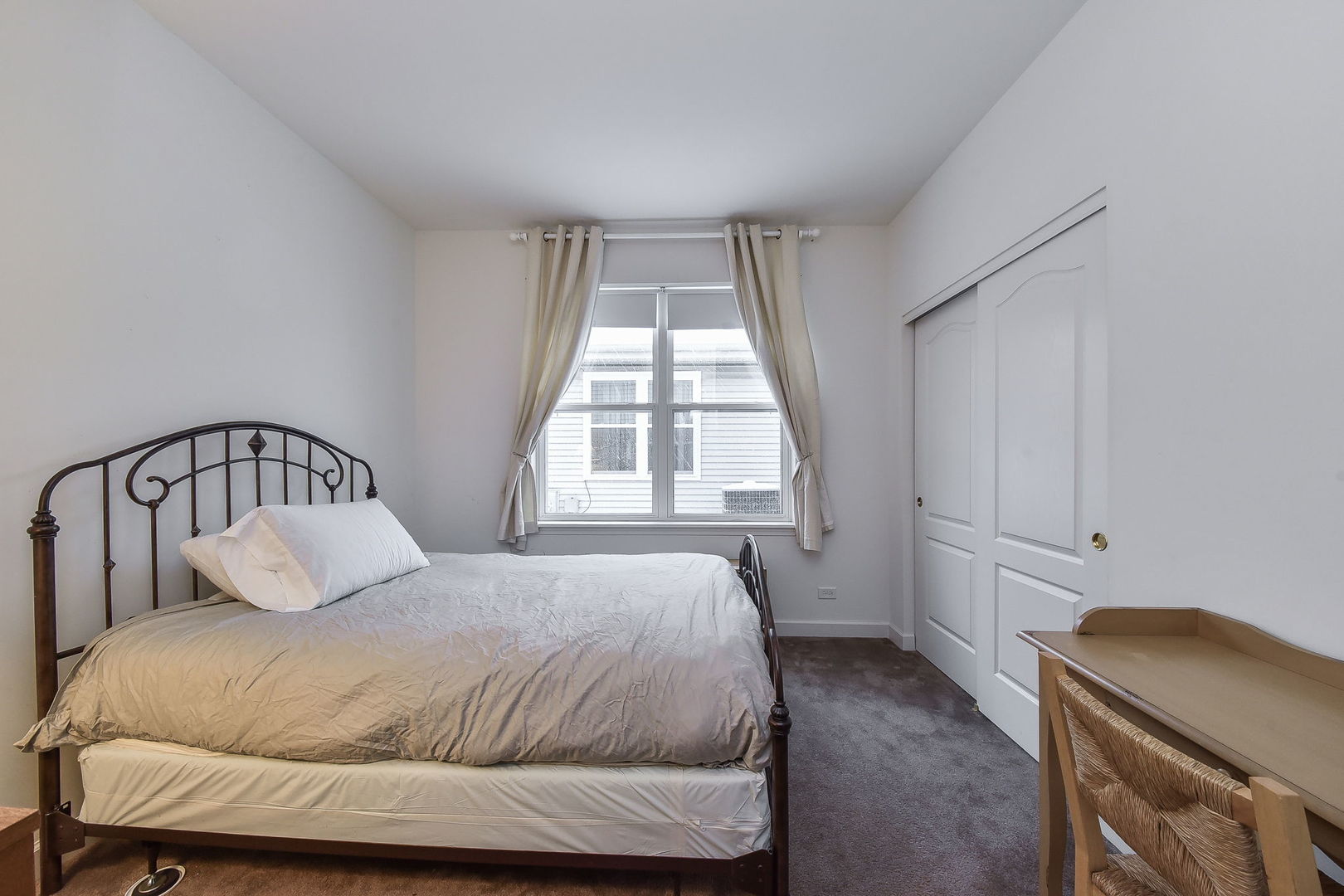 708 Bohannon Circle Oswego, IL 60543 - Photo 12 of 24 a bedroom with a bed and window