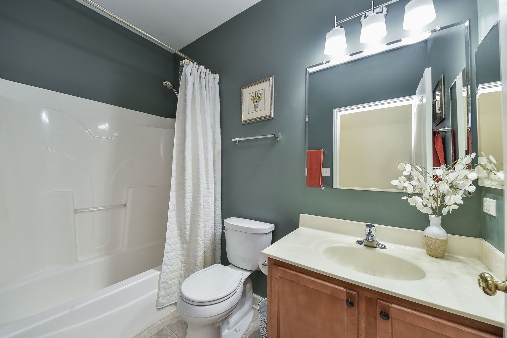 708 Bohannon Circle Oswego, IL 60543 - Photo 13 of 24 a bathroom with a sink toilet and shower