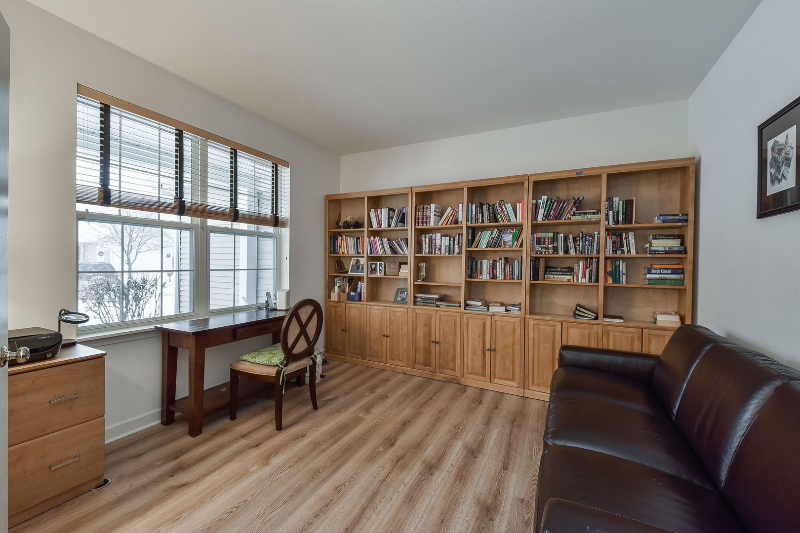 708 Bohannon Circle Oswego, IL 60543 - Photo 8 of 24 a view of a workspace with furniture and a window