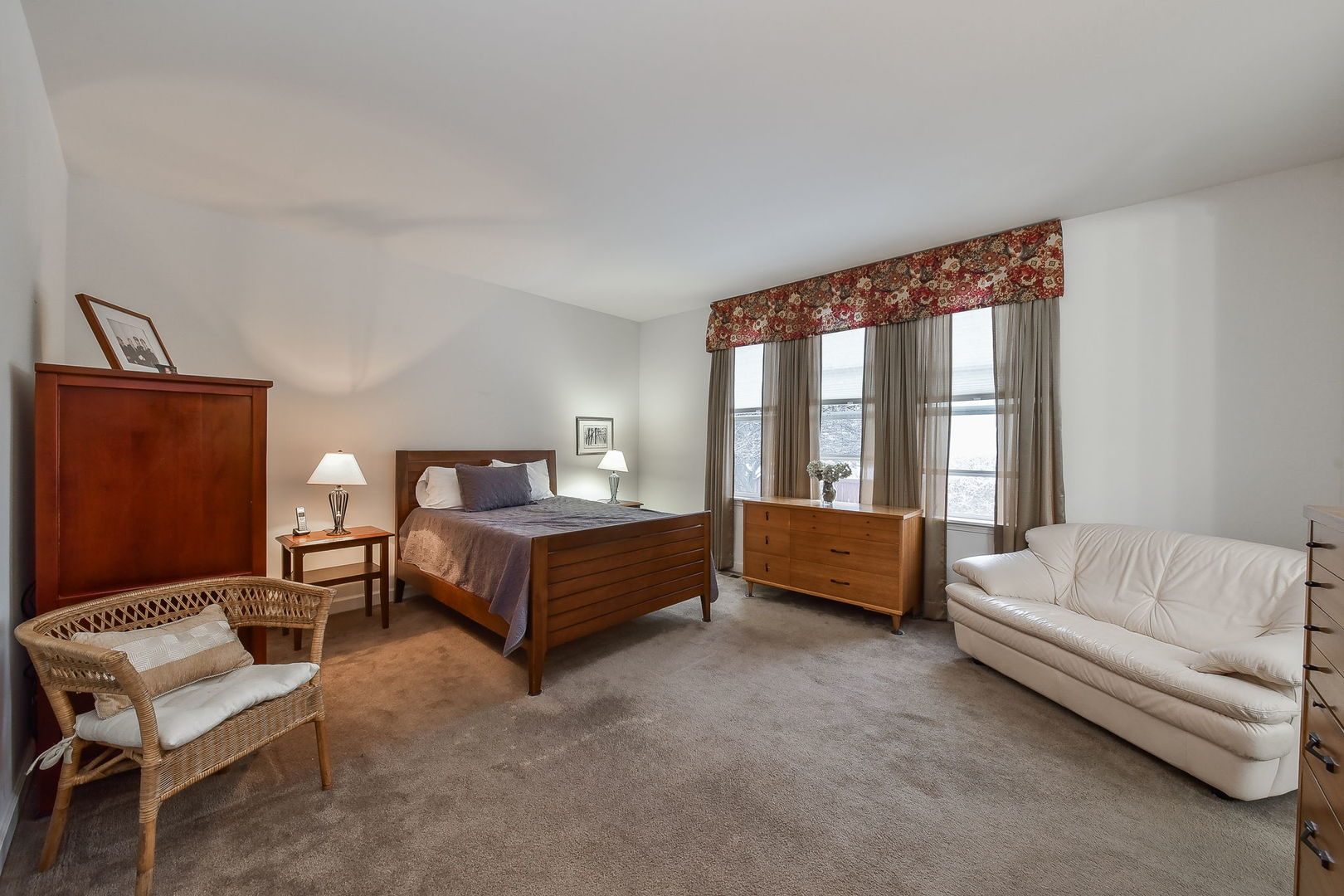 708 Bohannon Circle Oswego, IL 60543 - Photo 9 of 24 a bedroom with a bed and a couch next to a window