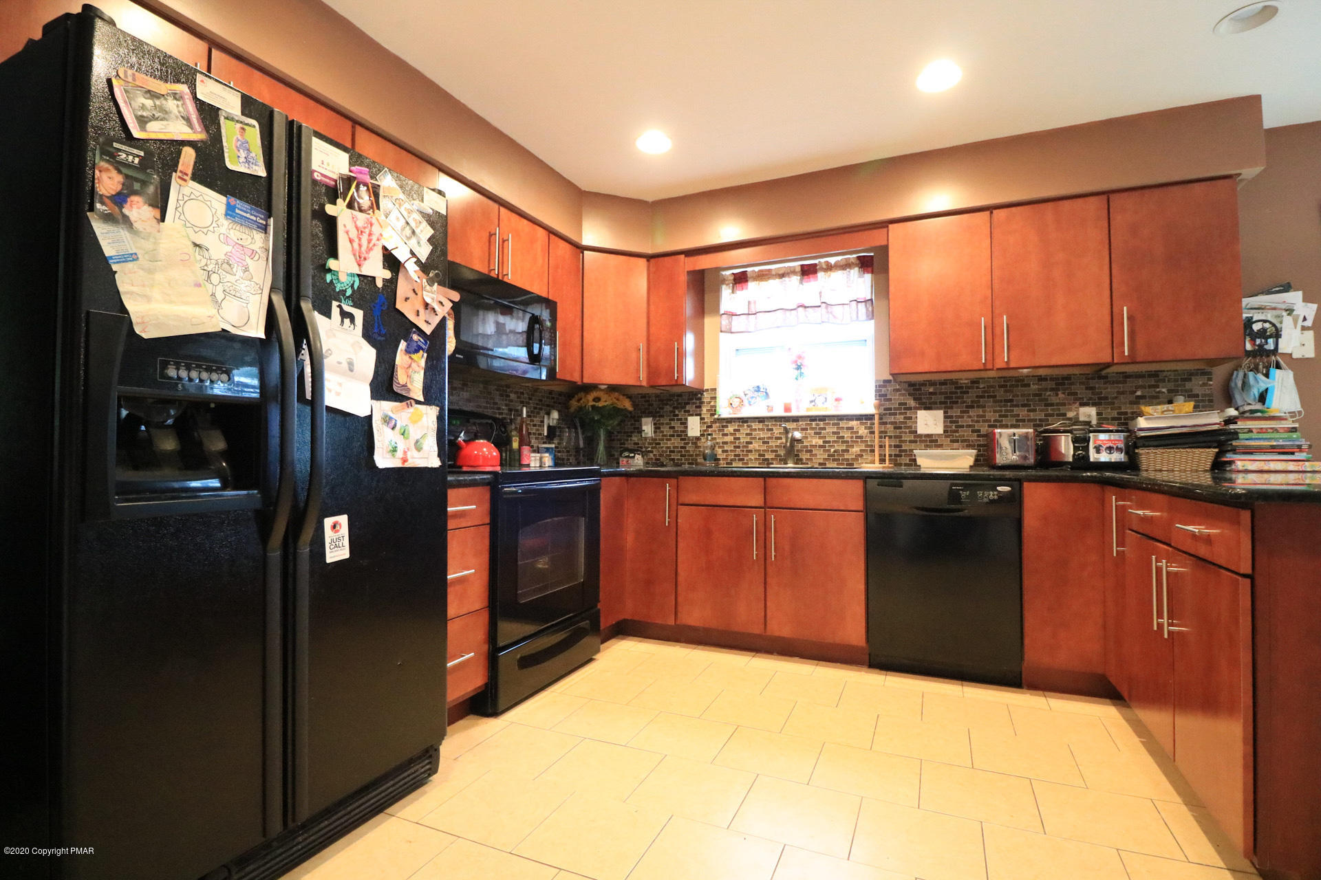 1024 State Road Effort, PA 18330 - Photo 16 of 46 a kitchen with stainless steel appliances granite countertop sink stove and refrigerator