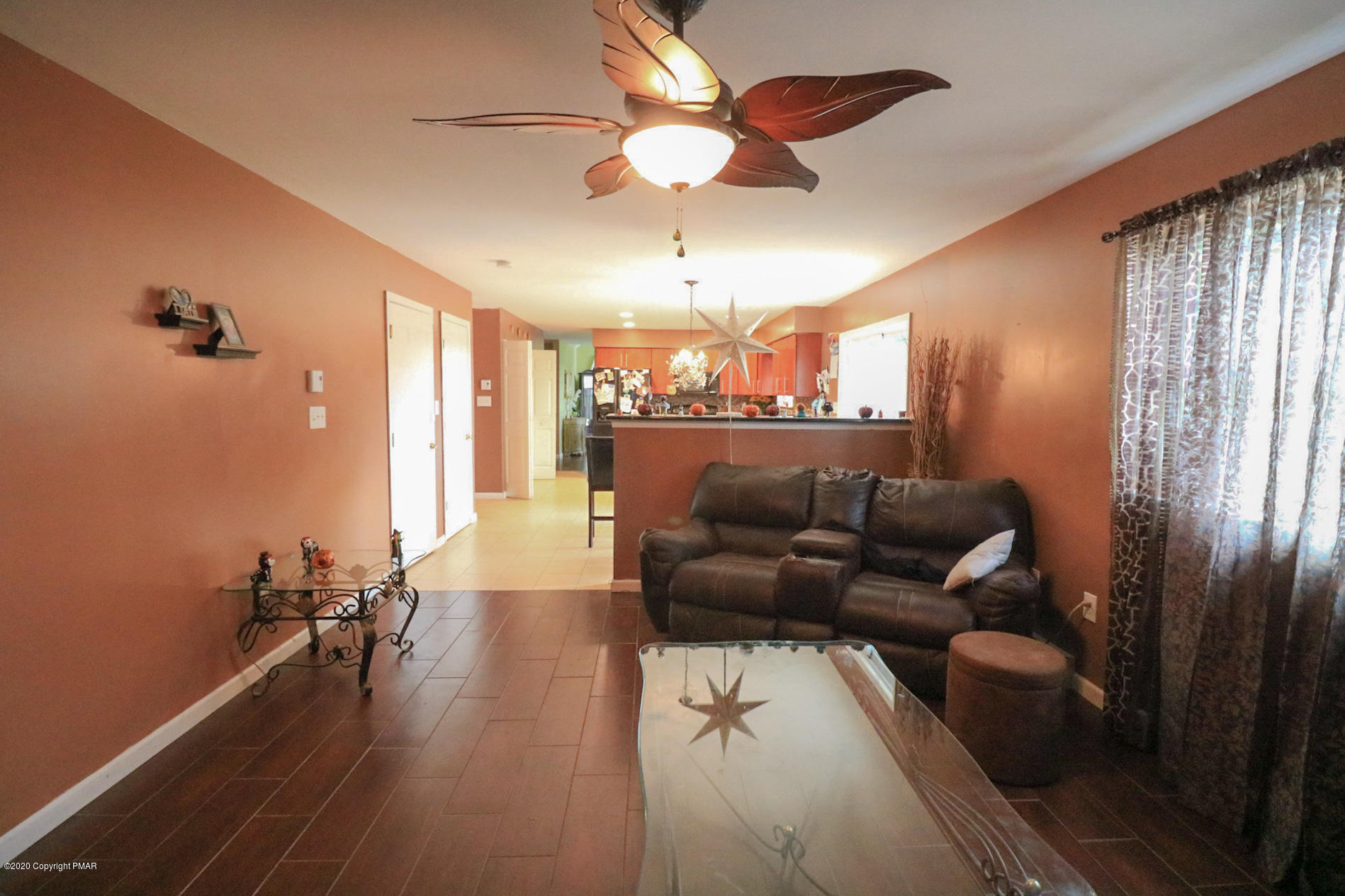1024 State Road Effort, PA 18330 - Photo 25 of 46 a living room with furniture and a chandelier