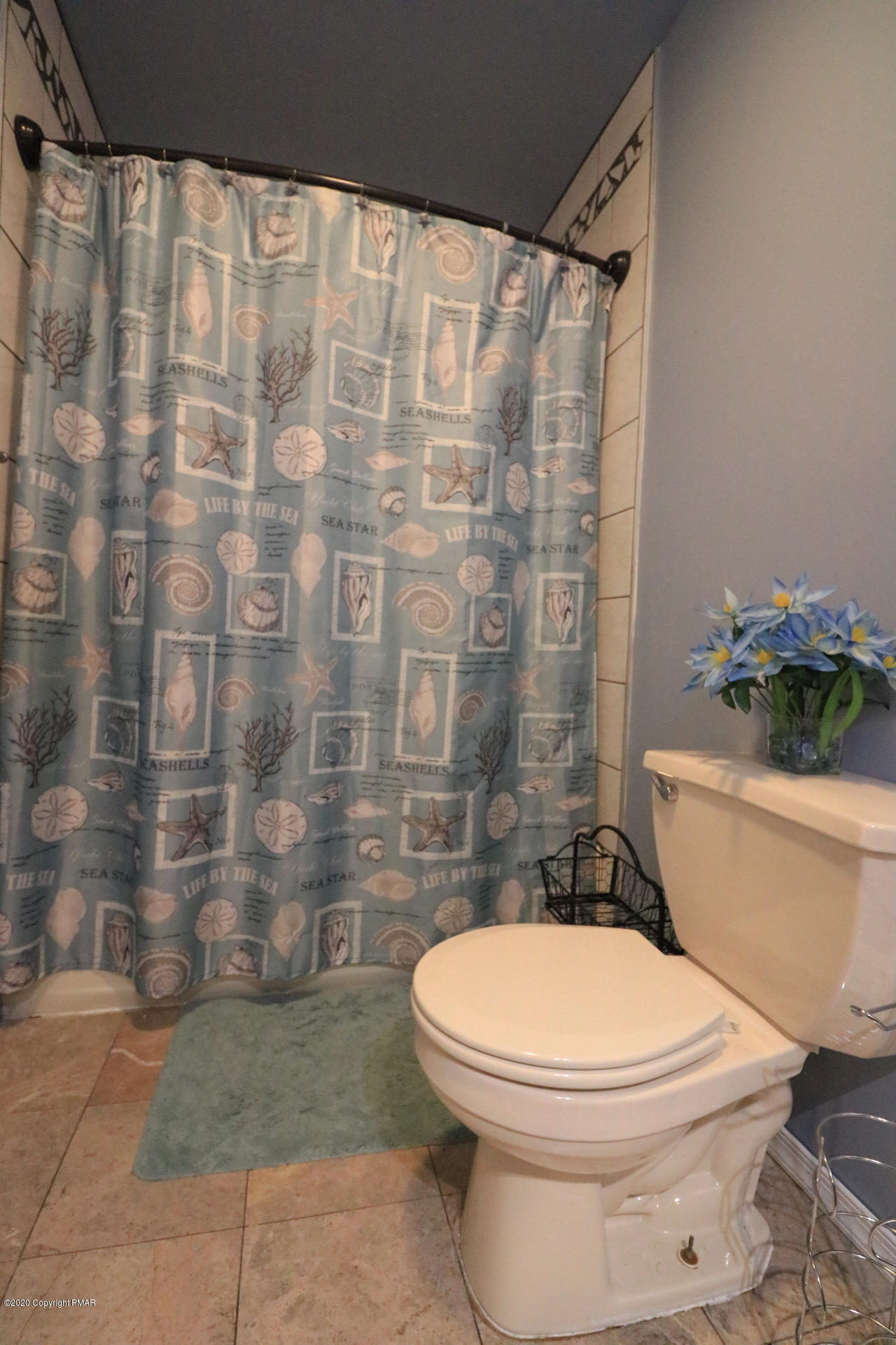 1024 State Road Effort, PA 18330 - Photo 33 of 46 a white toilet sitting next to a shower curtain