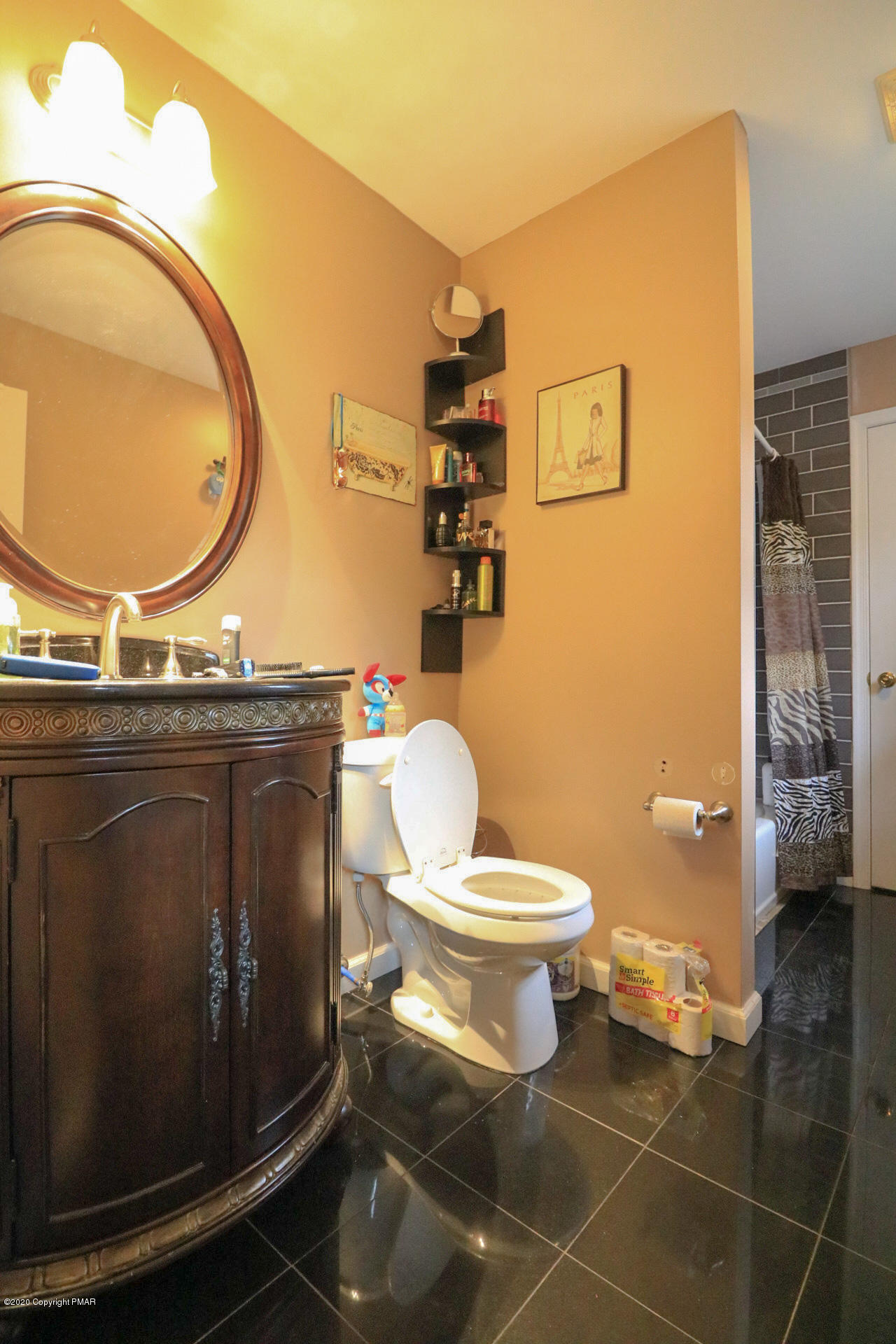 1024 State Road Effort, PA 18330 - Photo 39 of 46 a bathroom with a granite countertop toilet sink mirror and vanity