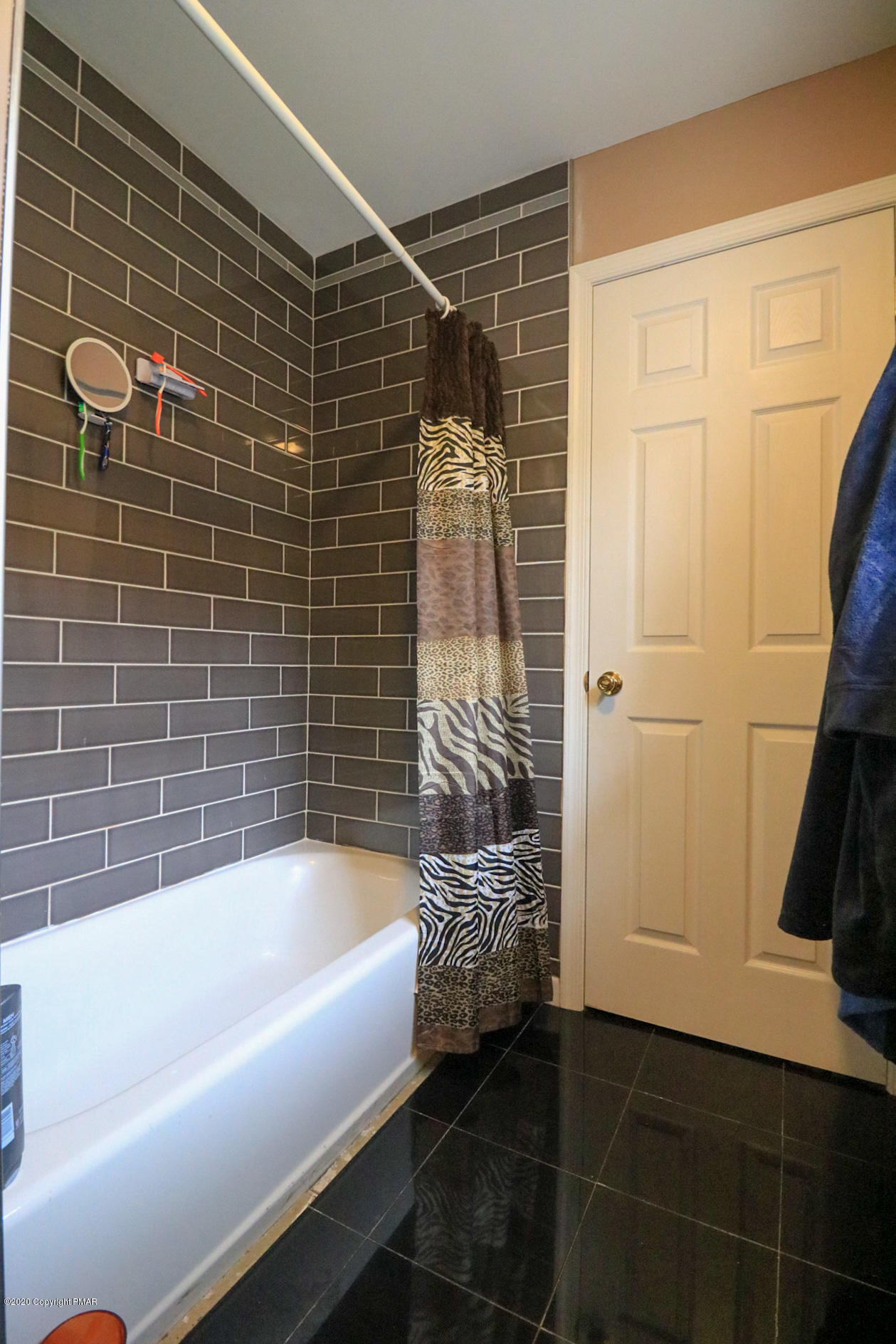 1024 State Road Effort, PA 18330 - Photo 40 of 46 a bathroom with a bathtub and a shower
