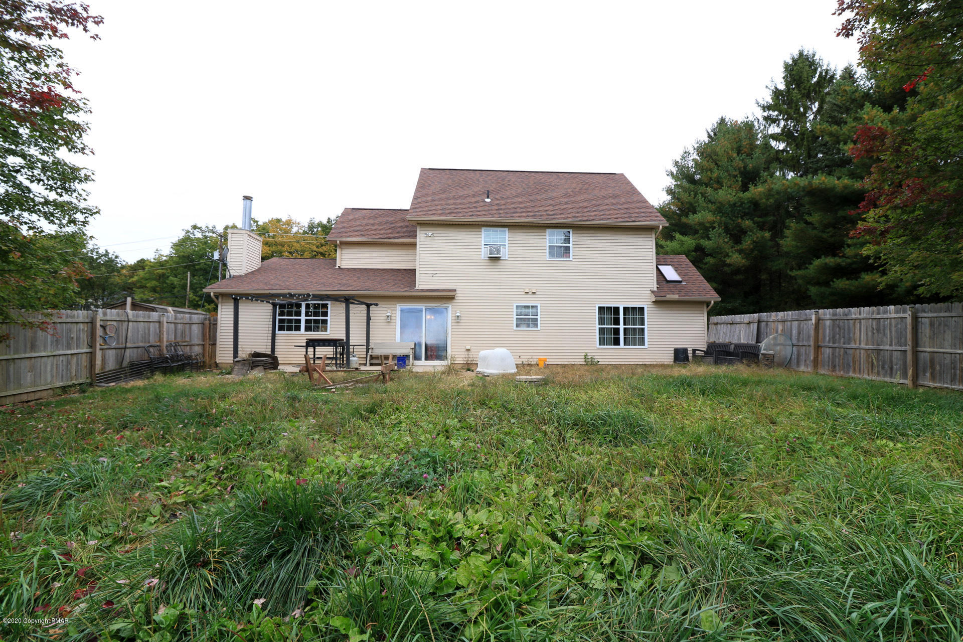 1024 State Road Effort, PA 18330 - Photo 44 of 46 a view of a yard in front of a house with plants and large tree