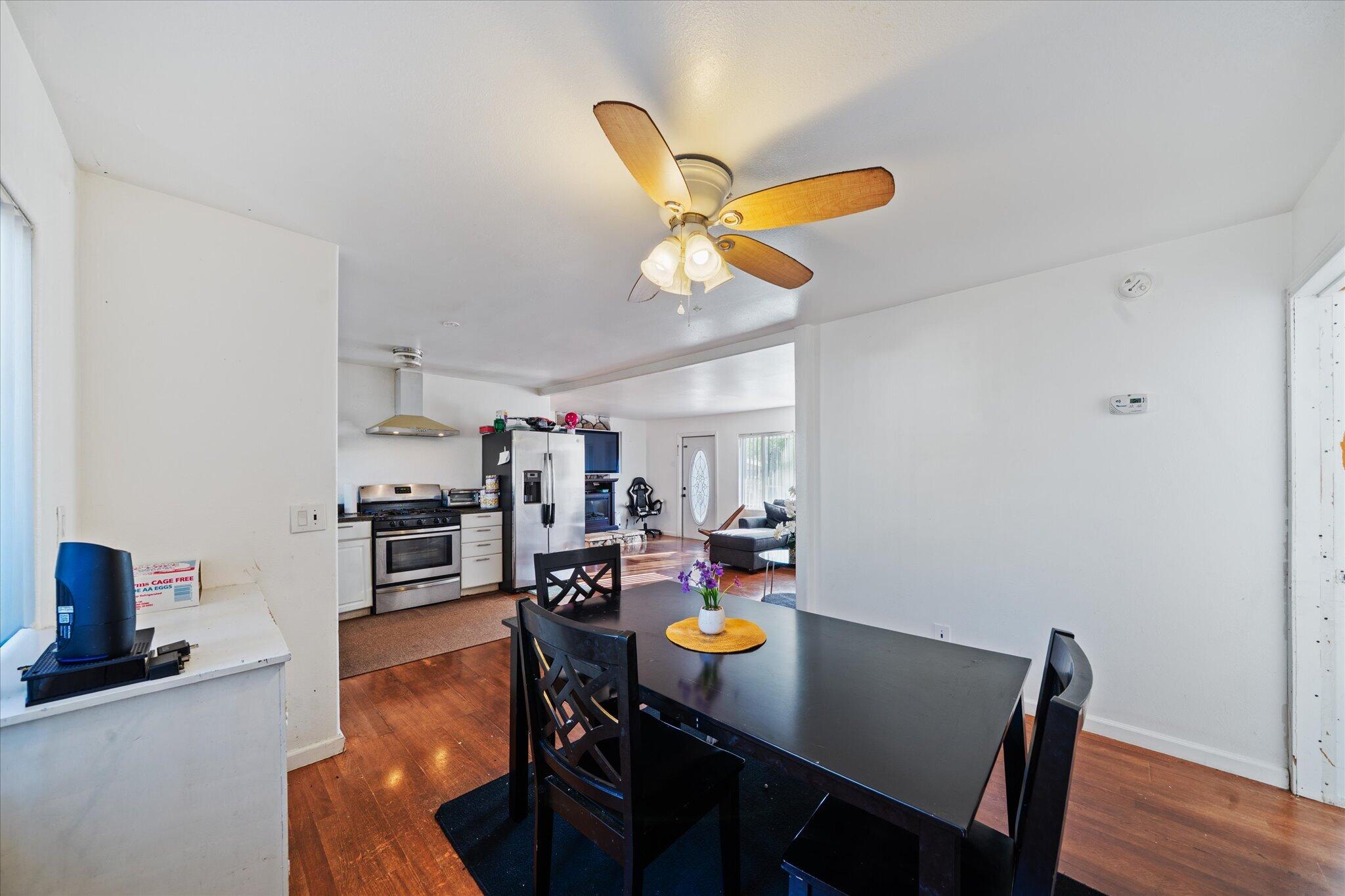2494 Delta Place, Unit 71 Redding, CA 96002 - Photo 11 of 24 a view of a dining room with furniture and wooden floor