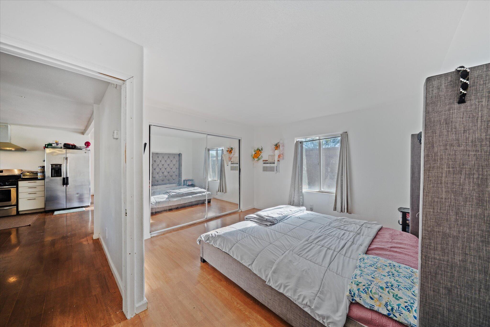 2494 Delta Place, Unit 71 Redding, CA 96002 - Photo 14 of 24 a bedroom with a bed and a view of living room