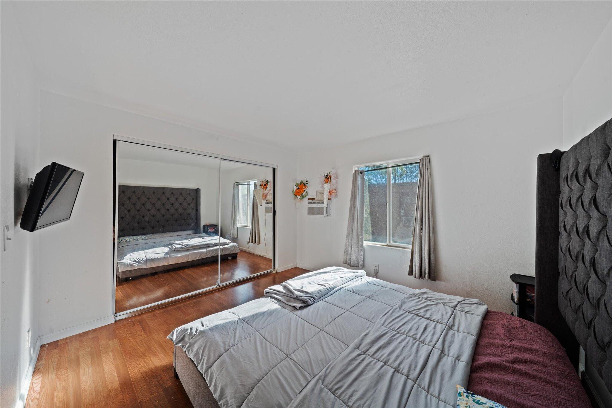 2494 Delta Place, Unit 71 Redding, CA 96002 - Photo 15 of 24 a bedroom with a bed and a flat screen tv