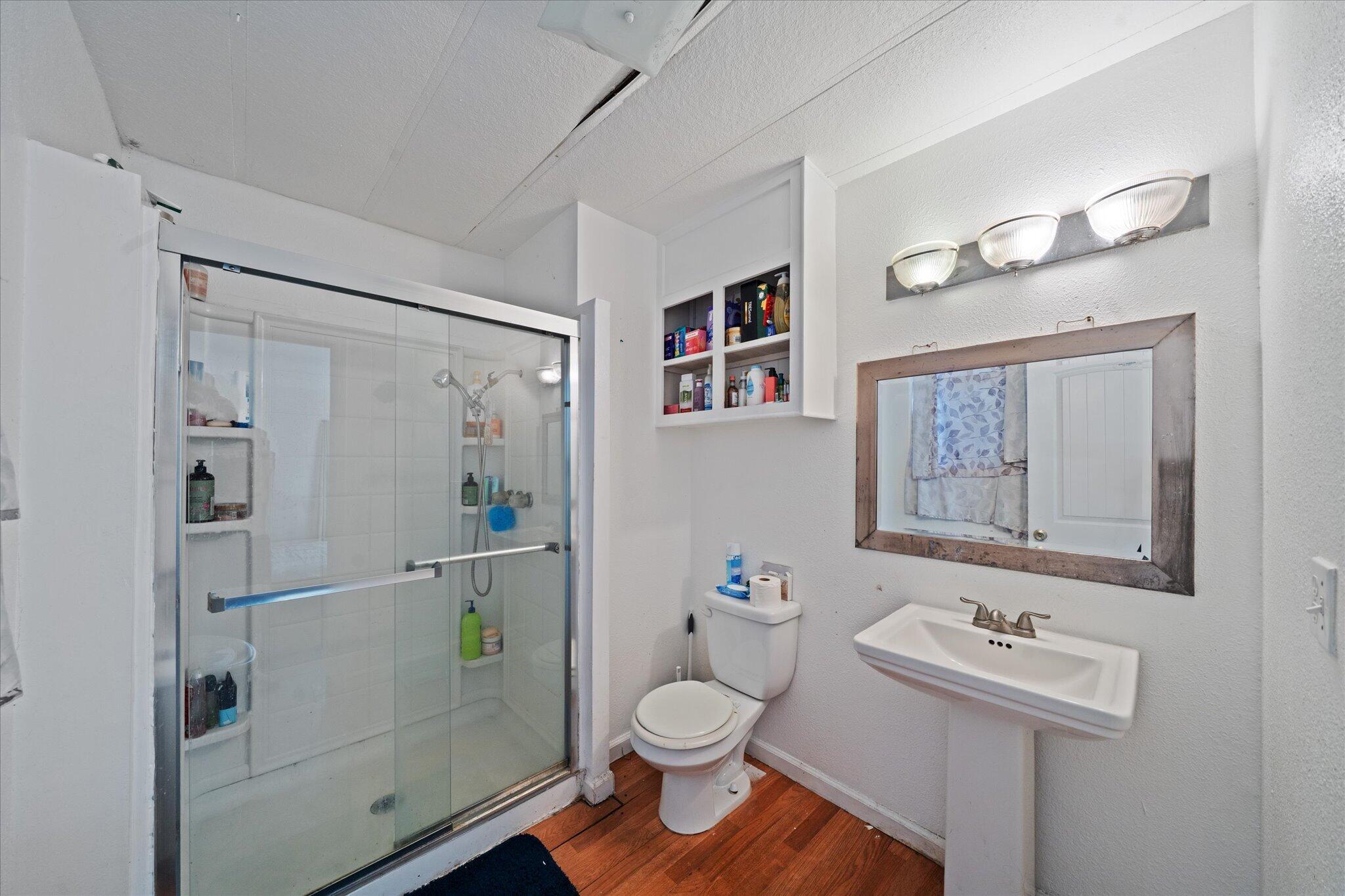 2494 Delta Place, Unit 71 Redding, CA 96002 - Photo 17 of 24 a bathroom with a sink toilet and a mirror