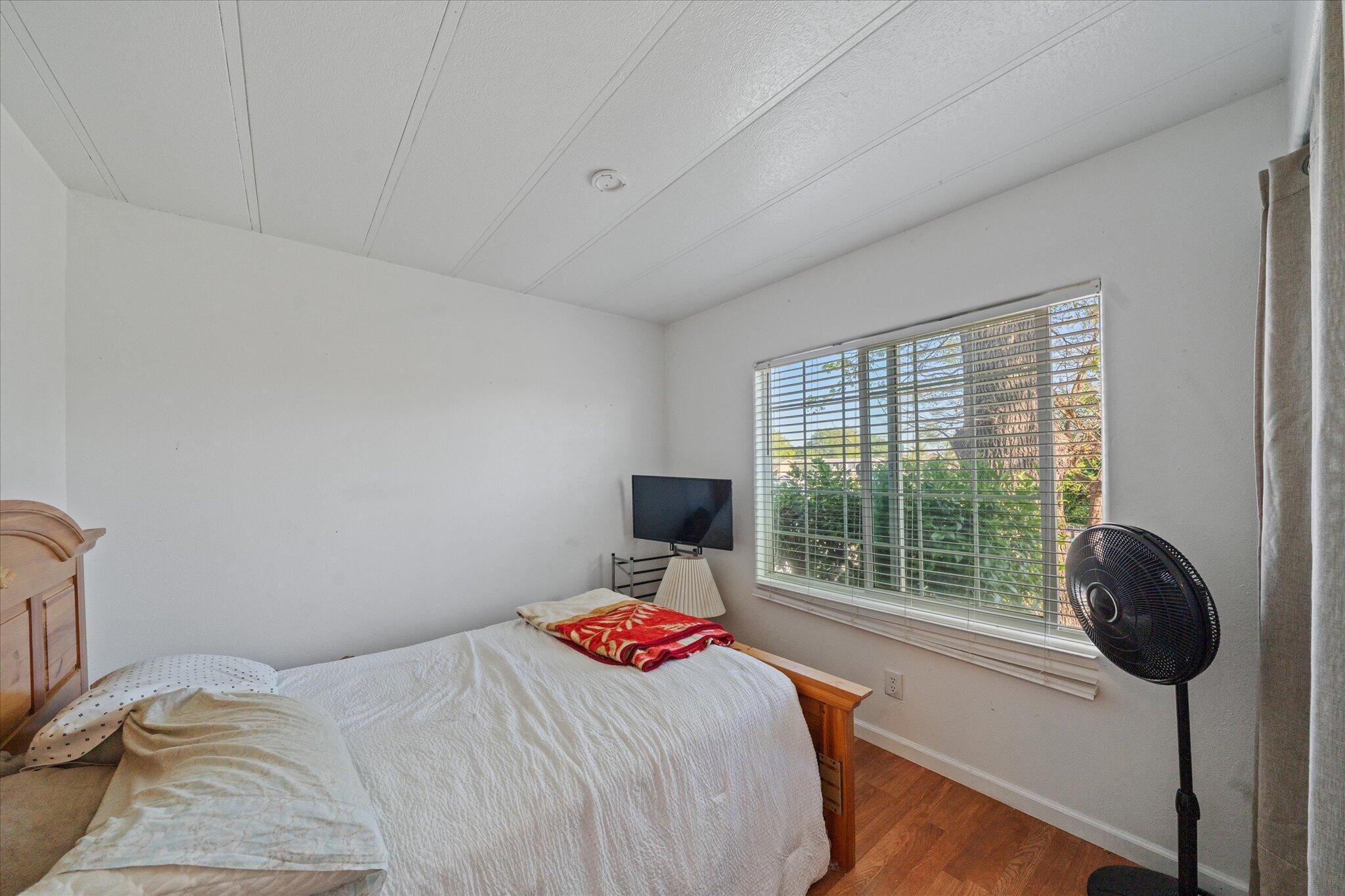 2494 Delta Place, Unit 71 Redding, CA 96002 - Photo 20 of 24 a bedroom with a bed and a window