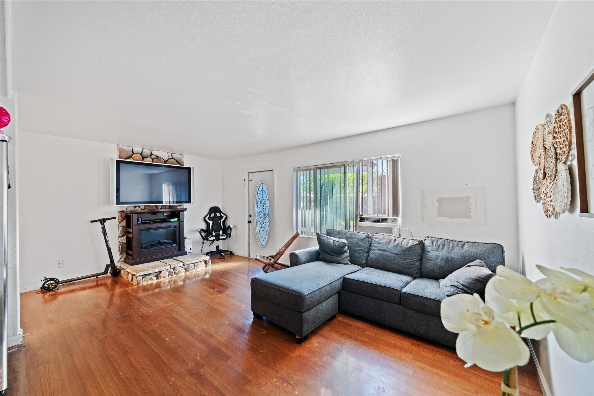 2494 Delta Place, Unit 71 Redding, CA 96002 - Photo 4 of 24 a living room with furniture window and a flat screen tv